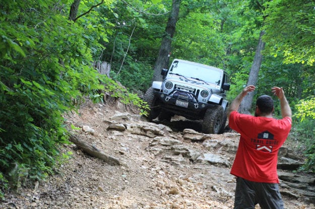 trail guide directing jeep