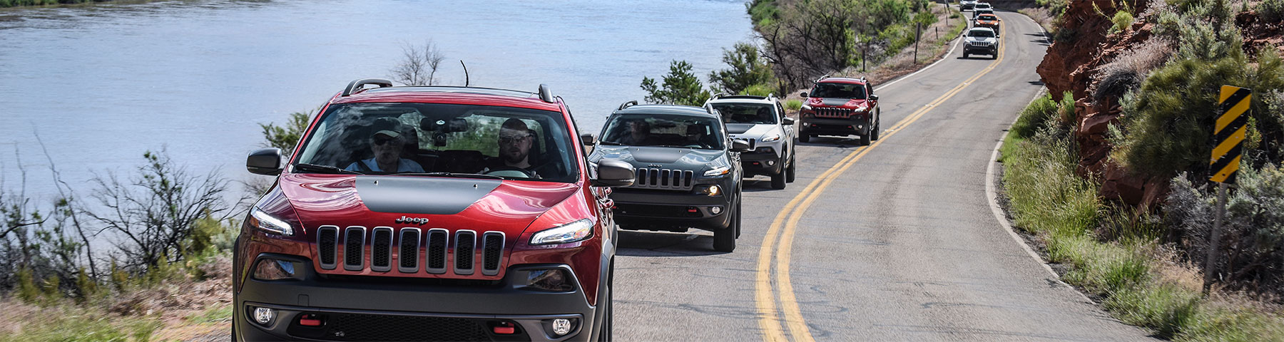 row of jeeps on the road