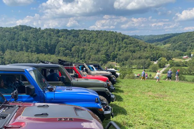 jeep in a row with cloudy skies