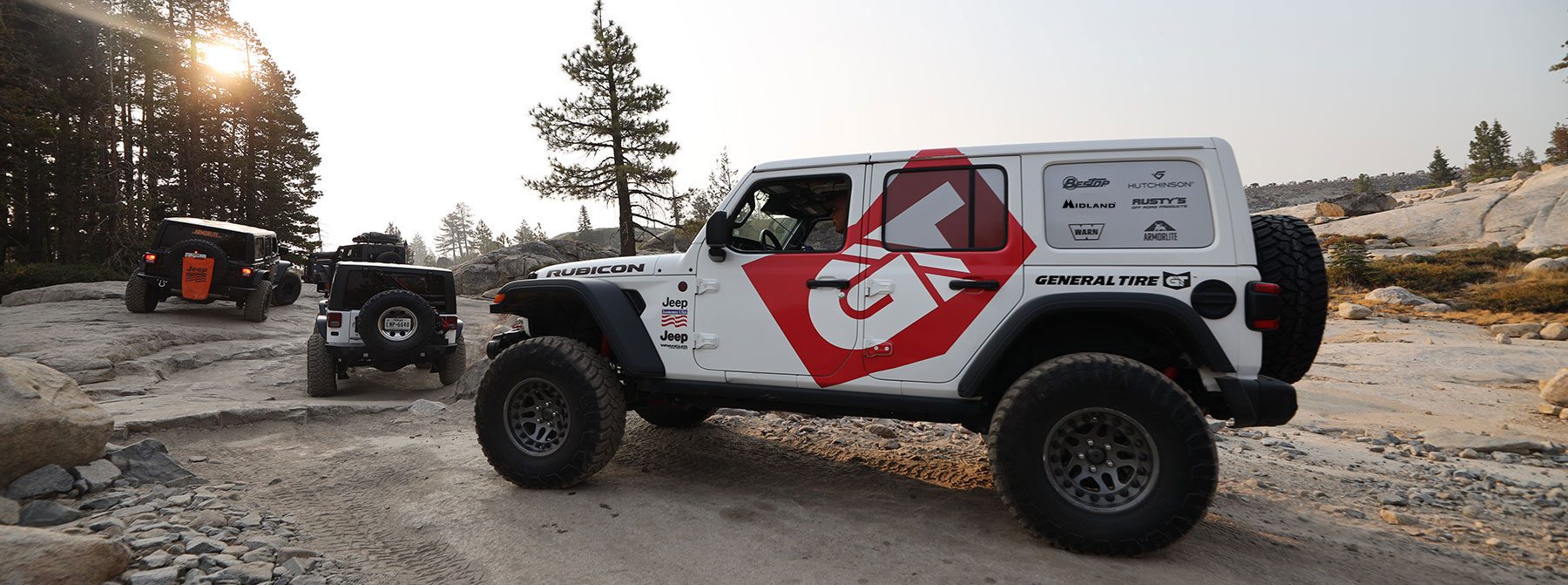 jeep with sponsor logos