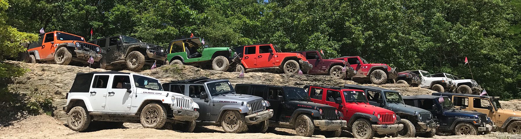 jeeps lined up on rocks