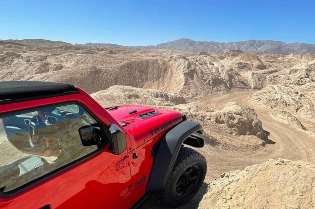 red rubicon at the top of a hill