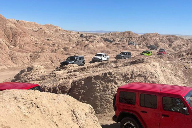 row of jeeps in the desert
